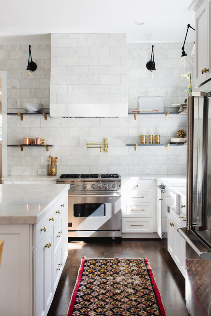 A Clean and elegant white kitchen with Waterstone fixtures